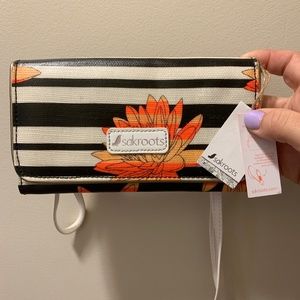sakroots wallet with crossbody and wristlet strap
